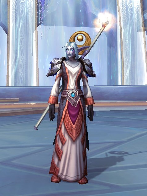 A snappily-dressed female Night Elf Holy Priest